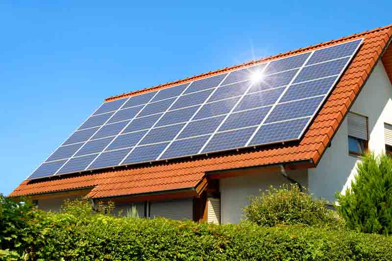 Solar panels catching sunlight on a residential roof