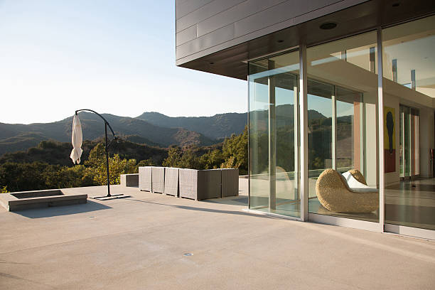 A modern home opening onto a quiet outdoor terrace